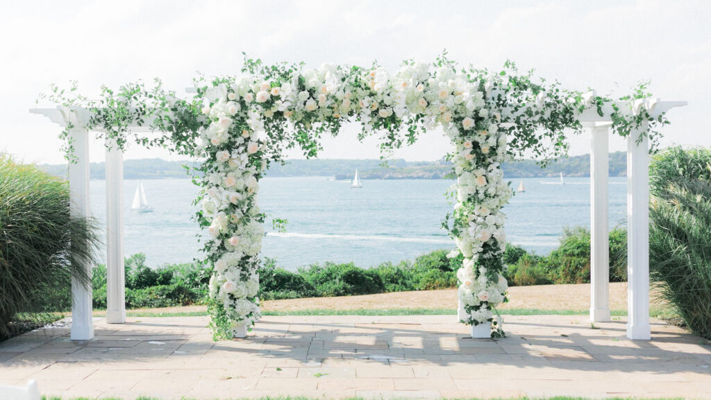 floral covered pergola infront of the ocean at oceancliff hotel